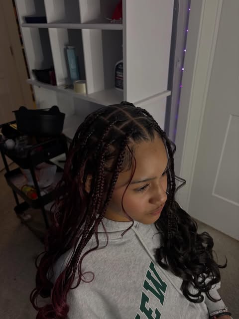 Braids with loose curls by Mia