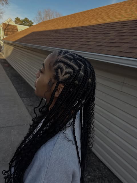 Mia’s heart-shaped stitch braids with long loose curls