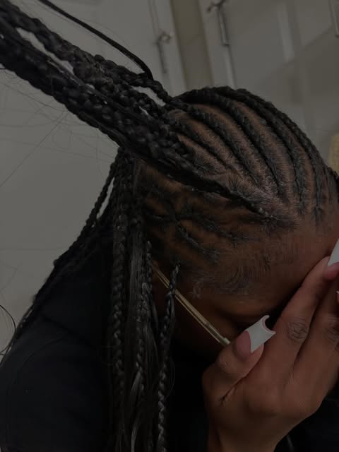 Mia’s detailed cornrows flowing into knotless braids
